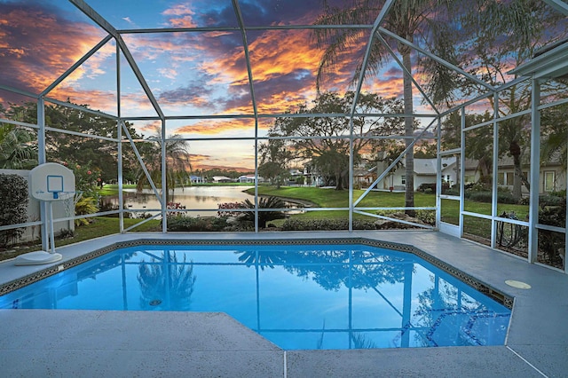 6193 Winding Lake Dr, Jupiter, FL 33458 - outdoor pool featuring a lanai, a water view, and a patio area