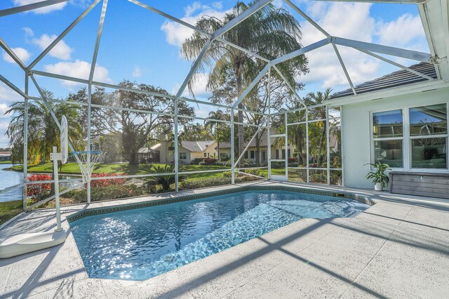 6193 Winding Lake Dr, Jupiter, FL 33458 - swimming pool featuring a lanai and a patio area