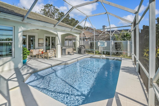 6193 Winding Lake Dr, Jupiter, FL 33458 - view of pool featuring a patio, an outdoor living space, and glass enclosure
