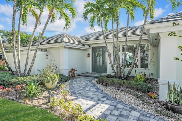 6193 Winding Lake Dr, Jupiter, FL 33458 - entrance to property with stucco siding and a tile roof