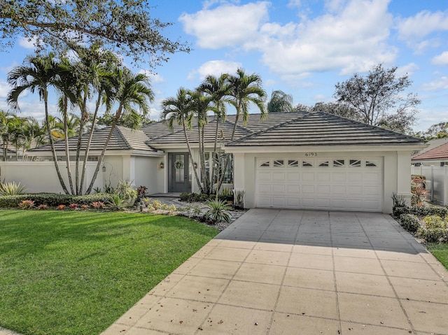 6193 Winding Lake Dr, Jupiter, FL 33458 - ranch-style home featuring stucco siding, a garage, and driveway