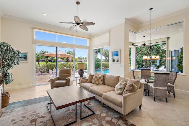 living room with ornamental molding, a ceiling fan, light tile patterned floors, baseboards, and a high ceiling