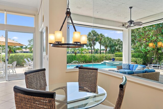 view of patio / terrace with a ceiling fan, outdoor lounge area, and a pool with connected hot tub