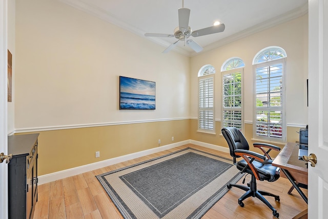 office space featuring light wood-style flooring, ornamental molding, baseboards, a ceiling fan, and recessed lighting