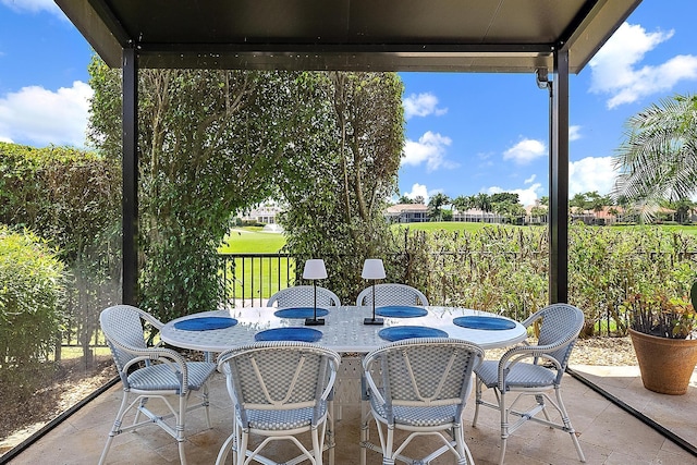 view of patio featuring fence