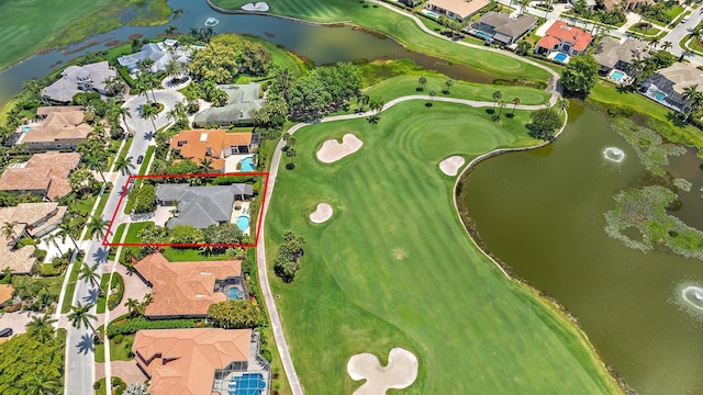 aerial perspective of suburban area featuring a large body of water, property boundaries highlighted, and a golf course