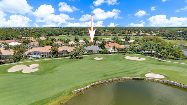 aerial view of residential area with a nearby body of water and a golf club