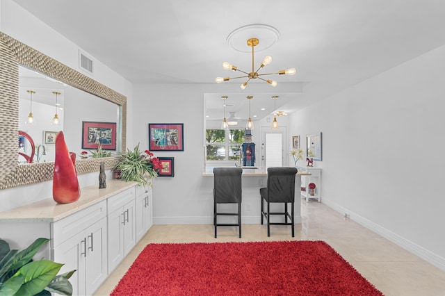 2403 Antigua Cir Unit M1, Coconut Creek, FL 33066 - dining area featuring a chandelier, baseboards, and light tile patterned floors