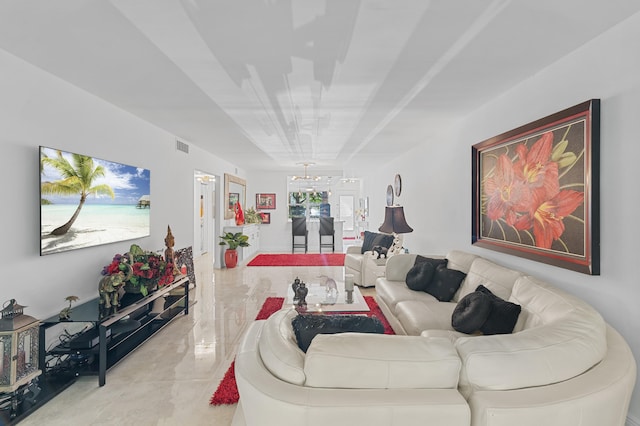 2403 Antigua Cir Unit M1, Coconut Creek, FL 33066 - living room featuring a chandelier