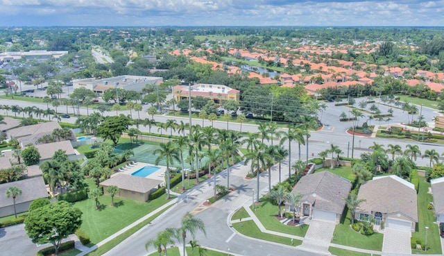 aerial view of property's location with nearby suburban area