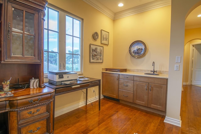 143 SE Bella Strano, Port Saint Lucie, FL 34984 - office area featuring arched walkways, crown molding, dark wood finished floors, a sink, and plenty of natural light