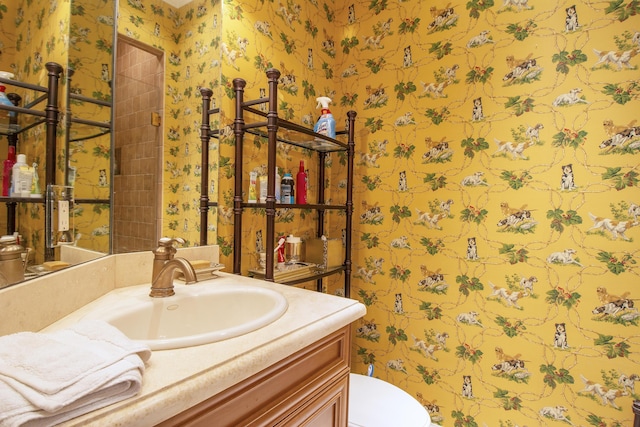 143 SE Bella Strano, Port Saint Lucie, FL 34984 - half bathroom with wallpapered walls, vanity, and toilet