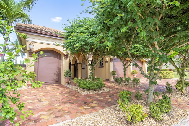 143 SE Bella Strano, Port Saint Lucie, FL 34984 - mediterranean / spanish-style house featuring stucco siding and a tiled roof