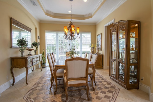 143 SE Bella Strano, Port Saint Lucie, FL 34984 - dining space featuring a chandelier, plenty of natural light, a raised ceiling, baseboards, and ornamental molding