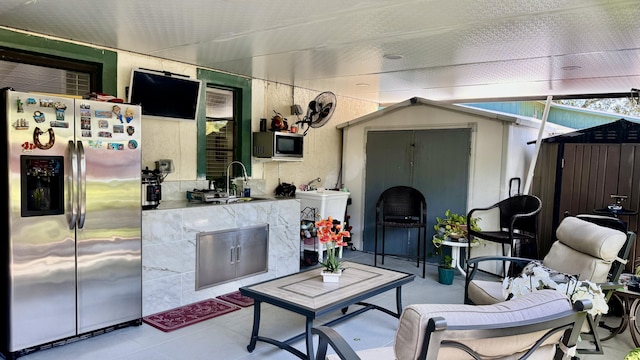 1053 Manor Dr Unit 14-A, Palm Springs, FL 33461 - view of patio featuring a sink