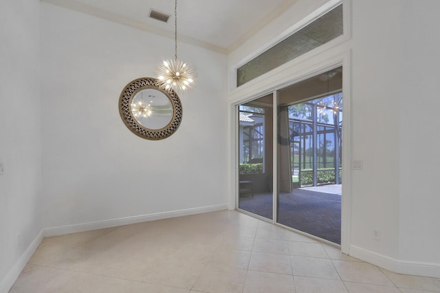 9400 Briarcliff Trce, Port Saint Lucie, FL 34986 - empty room with a chandelier, baseboards, light tile patterned floors, and ornamental molding