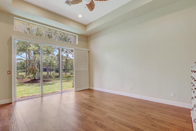 9400 Briarcliff Trce, Port Saint Lucie, FL 34986 - empty room featuring a ceiling fan, wood finished floors, baseboards, plenty of natural light, and recessed lighting