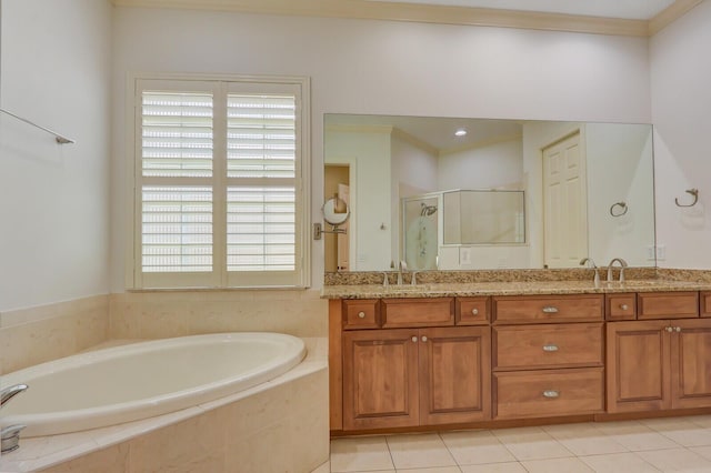 9400 Briarcliff Trce, Port Saint Lucie, FL 34986 - bathroom featuring a garden tub, a shower stall, double vanity, tile patterned floors, and crown molding