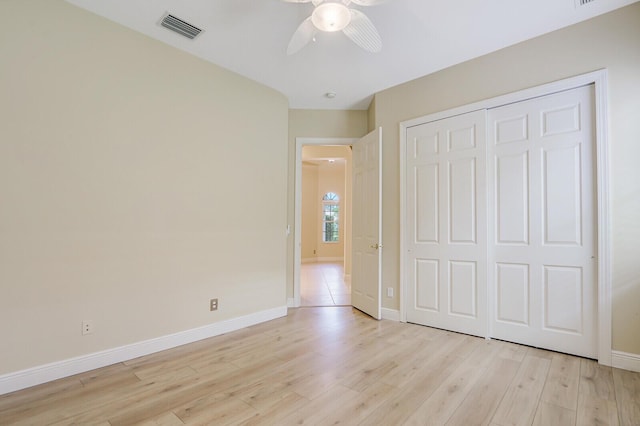 9400 Briarcliff Trce, Port Saint Lucie, FL 34986 - unfurnished bedroom featuring light wood-style floors, baseboards, a closet, and a ceiling fan