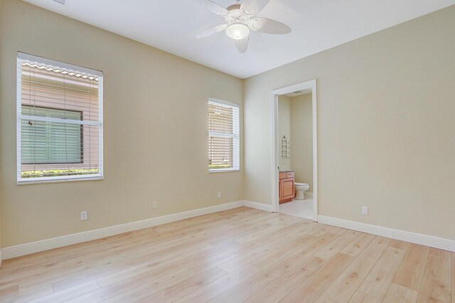 9400 Briarcliff Trce, Port Saint Lucie, FL 34986 - unfurnished room with light wood-type flooring, a ceiling fan, and baseboards