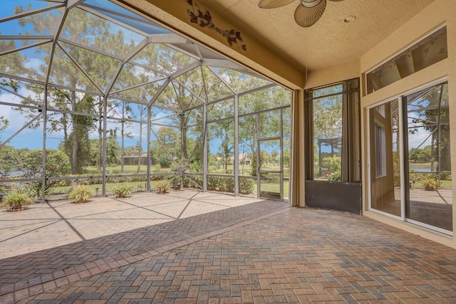 9400 Briarcliff Trce, Port Saint Lucie, FL 34986 - unfurnished sunroom featuring ceiling fan