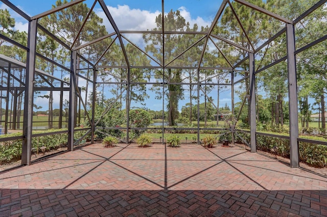 9400 Briarcliff Trce, Port Saint Lucie, FL 34986 - unfurnished sunroom featuring a water view