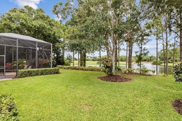 9400 Briarcliff Trce, Port Saint Lucie, FL 34986 - view of grassy yard with a lanai and a water view