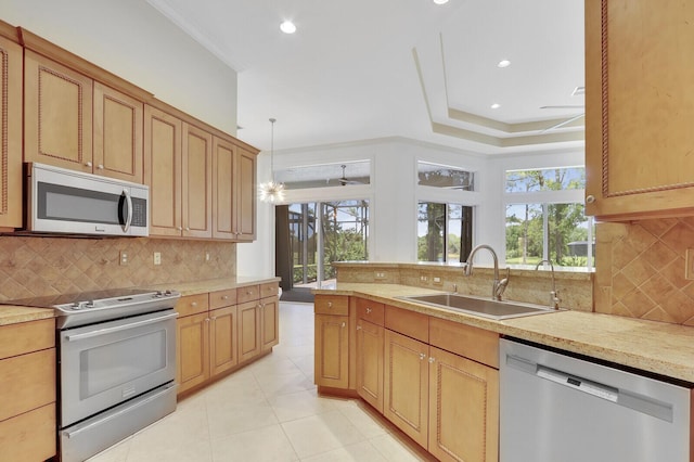 9400 Briarcliff Trce, Port Saint Lucie, FL 34986 - kitchen with stainless steel appliances, a sink, backsplash, light tile patterned floors, and recessed lighting