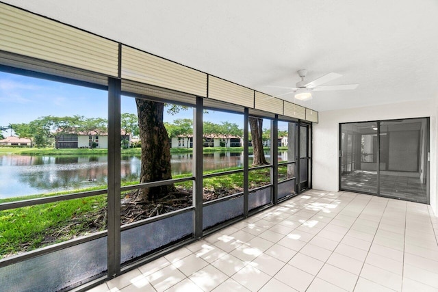 10679 Ocean Palm Way Unit 101, Boynton Beach, FL 33437 - unfurnished sunroom with a ceiling fan and a water view