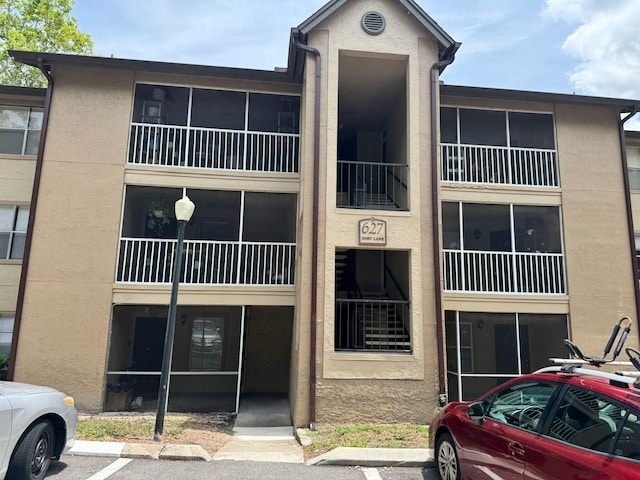 627 Dory Ln Unit 304, Altamonte Springs, FL 32714 - view of property featuring uncovered parking