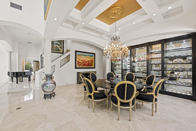 dining area featuring a towering ceiling, decorative columns, coffered ceiling, ornamental molding, and recessed lighting