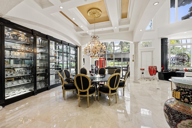dining area featuring a towering ceiling, marble tiled flooring, coffered ceiling, a chandelier, and beamed ceiling