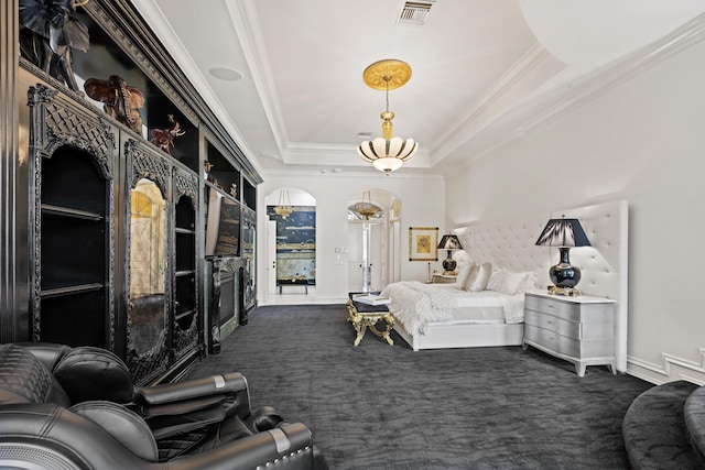 carpeted bedroom featuring ornamental molding, arched walkways, a raised ceiling, and baseboards