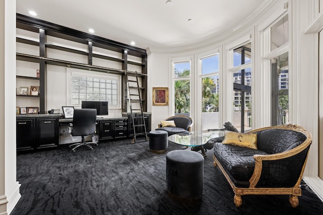 home office with ornamental molding, dark colored carpet, plenty of natural light, and recessed lighting