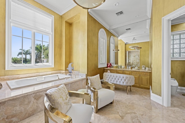 full bathroom featuring toilet, marble tiled floors, a bath, ornamental molding, and vanity