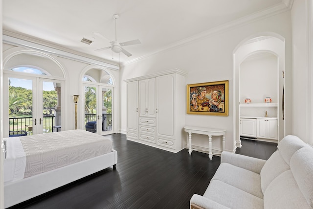 bedroom with access to outside, french doors, ornamental molding, dark wood-style floors, and arched walkways
