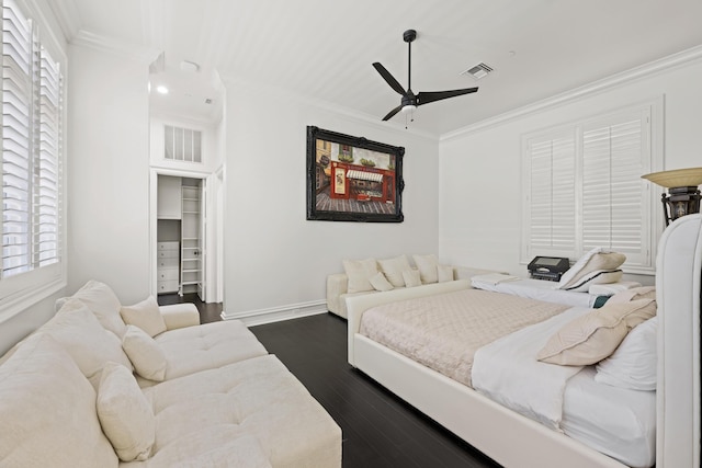 bedroom featuring ornamental molding, dark wood-style floors, ceiling fan, and baseboards