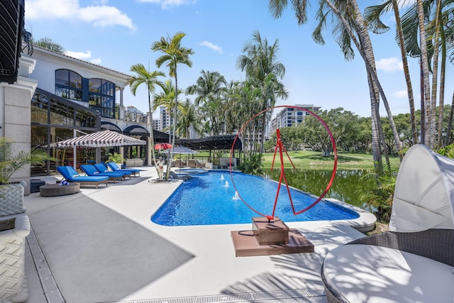 view of swimming pool featuring a patio area and a pool with connected hot tub