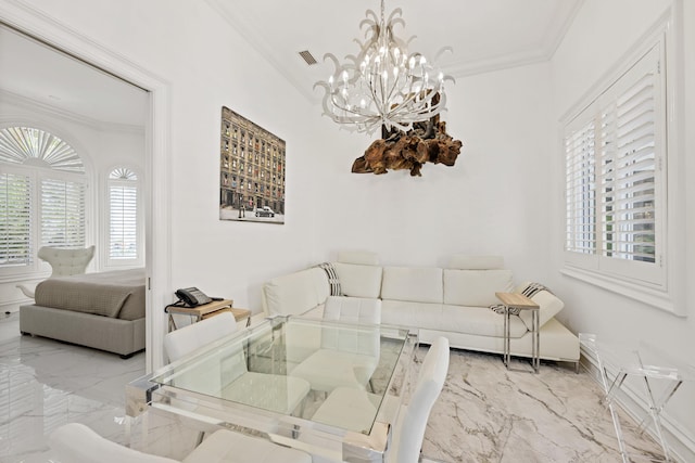 living room featuring marble tiled floors, crown molding, a chandelier, and baseboards