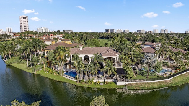 view of property location with a large body of water and nearby urban area
