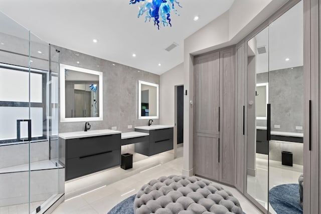 1010 Delray Lakes Dr, Delray Beach, FL 33444 - full bathroom with two vanities, tile patterned flooring, a stall shower, and recessed lighting