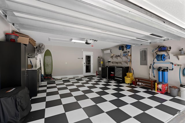 1010 Delray Lakes Dr, Delray Beach, FL 33444 - garage with electric panel, electric water heater, and a garage door opener