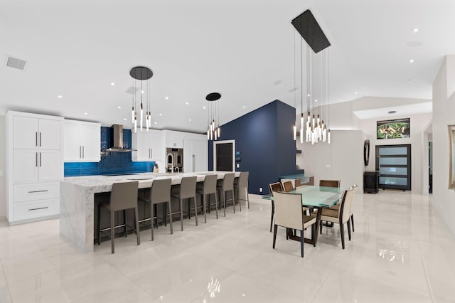 1010 Delray Lakes Dr, Delray Beach, FL 33444 - dining space featuring recessed lighting, vaulted ceiling, and light tile patterned flooring
