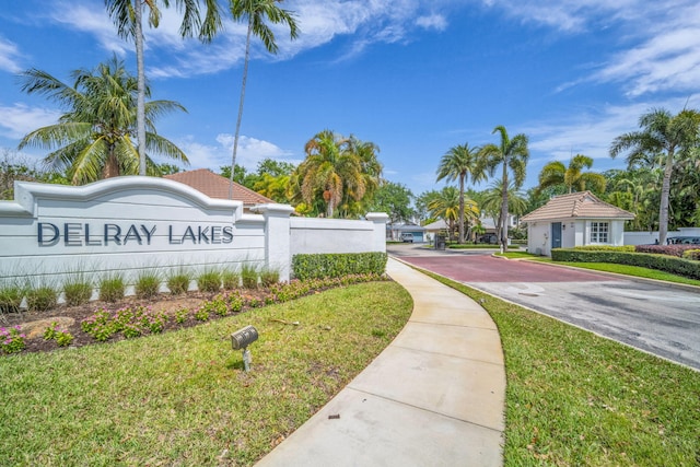 1010 Delray Lakes Dr, Delray Beach, FL 33444 - community / neighborhood sign featuring driveway and a lawn