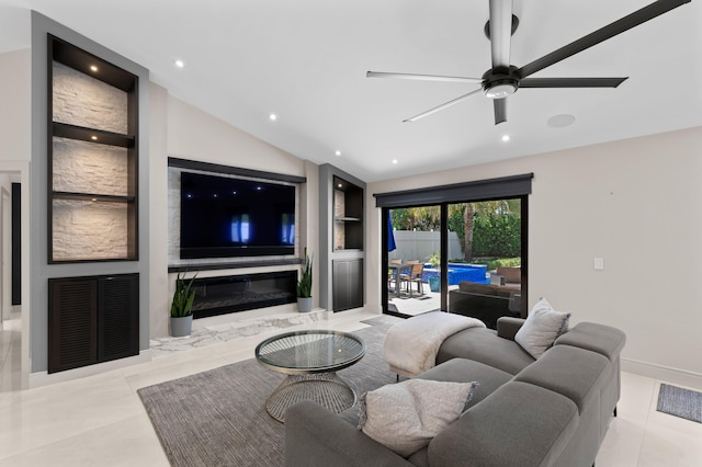 1010 Delray Lakes Dr, Delray Beach, FL 33444 - living area with built in shelves, a ceiling fan, a premium fireplace, lofted ceiling, and recessed lighting