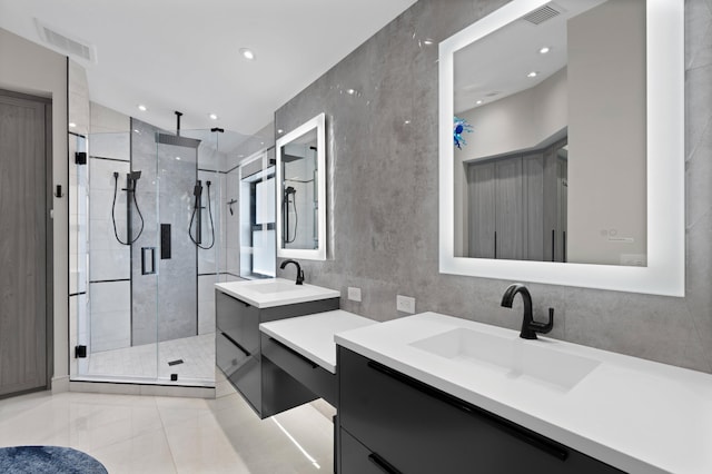 1010 Delray Lakes Dr, Delray Beach, FL 33444 - full bath featuring a shower stall, two vanities, recessed lighting, and tile patterned floors