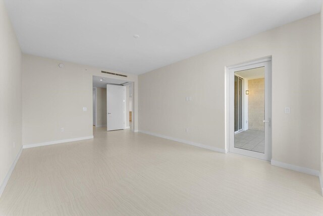220 SE Mizner Blvd Unit 609, Boca Raton, FL 33432 - empty room featuring baseboards