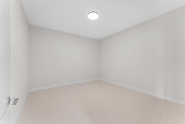 220 SE Mizner Blvd Unit 609, Boca Raton, FL 33432 - empty room featuring light colored carpet and baseboards