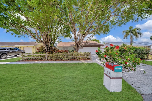 9152 Affirmed Ln, Boca Raton, FL 33496 - view of yard featuring a garage