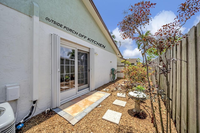 9152 Affirmed Ln, Boca Raton, FL 33496 - view of home's exterior featuring fence and stucco siding
